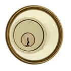 Circular brass deadbolt lock cylinder with a centered keyhole