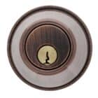Circular deadbolt lock cylinder with an oil-rubbed bronze finish and a brass keyhole