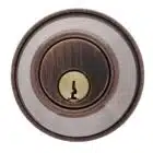 Circular deadbolt lock cylinder with an oil-rubbed bronze finish and a brass keyhole
