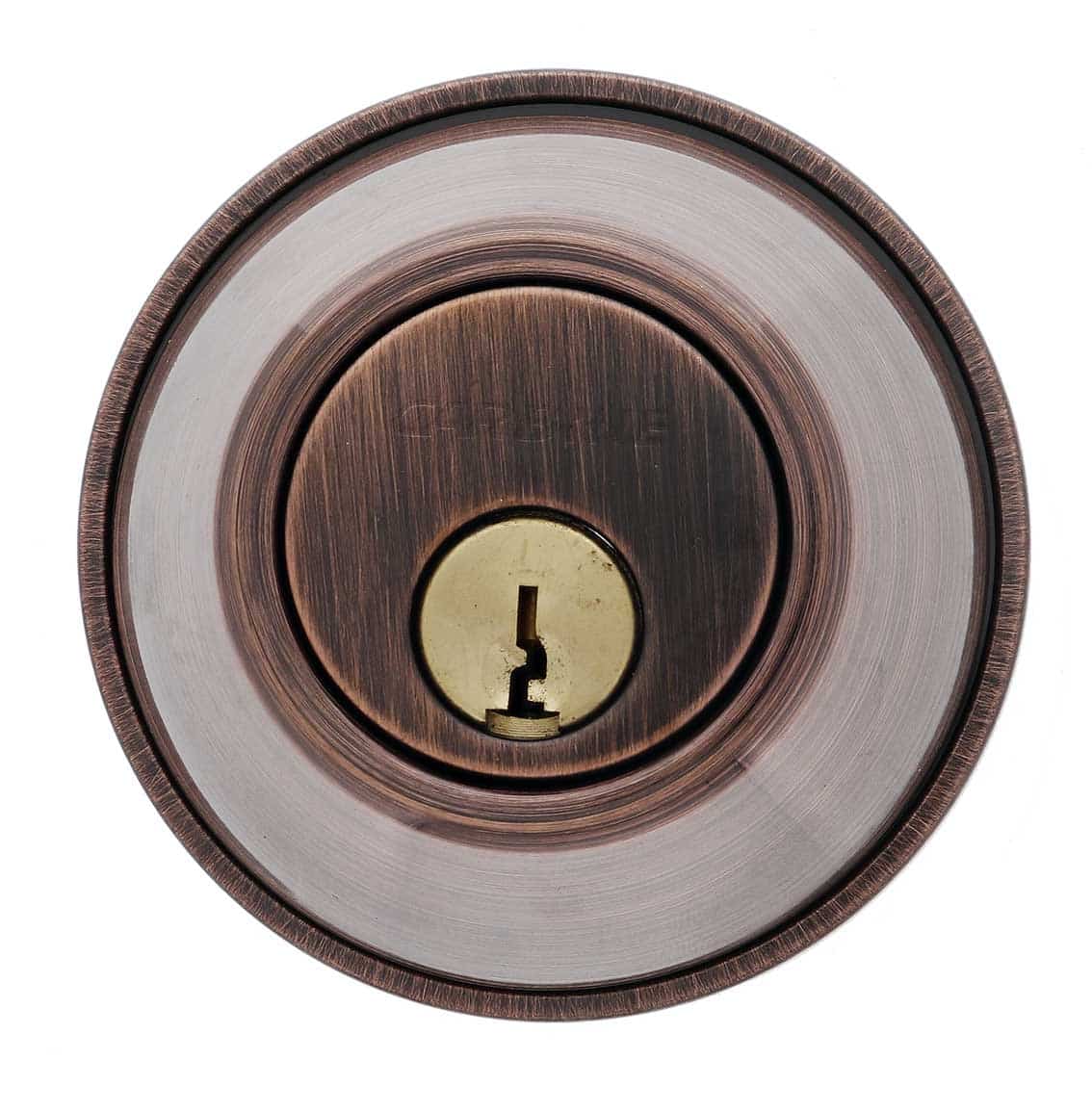 Circular deadbolt lock cylinder with an oil-rubbed bronze finish and a brass keyhole