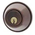 Carbine deadbolt lock cylinder in oil-rubbed bronze with a brass keyhole