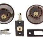 Carbine double cylinder deadbolt set in antique bronze finish with latch, strike plate, and two keys
