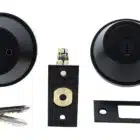 Matte black deadbolt lock set including interior and exterior faces, latch, strike plate, and two keys